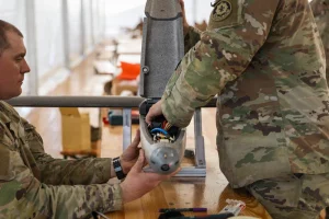 U.S. Army Staff Sgt. Nicholas Davis and Staff Sgt. Terrence Giles, with the Field Artillery Squadron, 2d Cavalry Regiment, assemble a one-way attack Hornet drone during training in preparation for flight operations at Bemowo Piskie Training Area, Poland, May 3, 2026. (U.S. Army Reserve photo by Capt. Katherine Bustos)